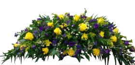 Casket spray in yellows and purples